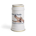 A white ceramic beer stein featuring a vintage-style illustration of a winged woman and the text 'Queens of Antifa' and 'Fighting for Freedom since 1941'.